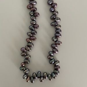 Beautiful 18” peacock pearl necklace with lobster claw clasp.